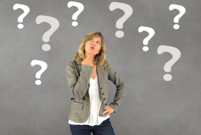 woman surrounded by question marks