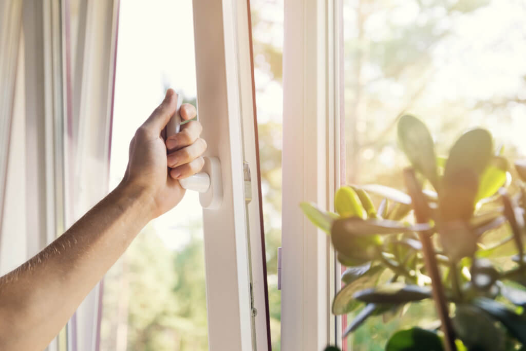 hand open white plastic pvc window at home Opening Window Fresh, Clean Air Indoors