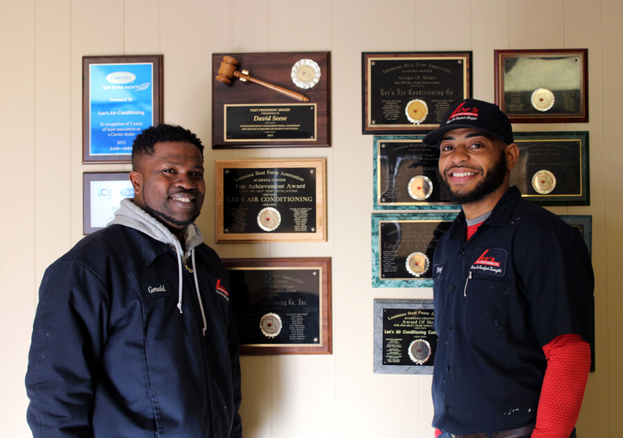 Smiling-Techs-with-Awards---SIZED HVAC Technicians Smiling next to Awards