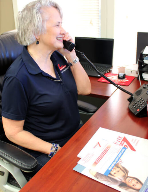 Woman on Phone Talking to Customer