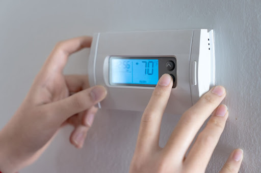 Thermostat inside a home in Lafayette, set to seventy degrees on cool. 