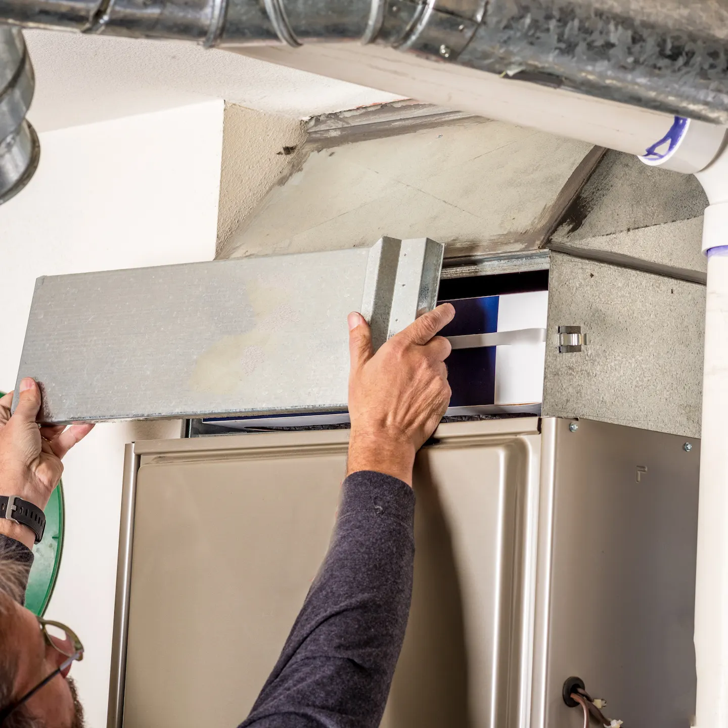 Lee’s HVAC technician making repairs to a furnace that won’t turn on.