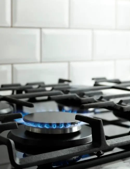 Kitchen range all four burners are on.