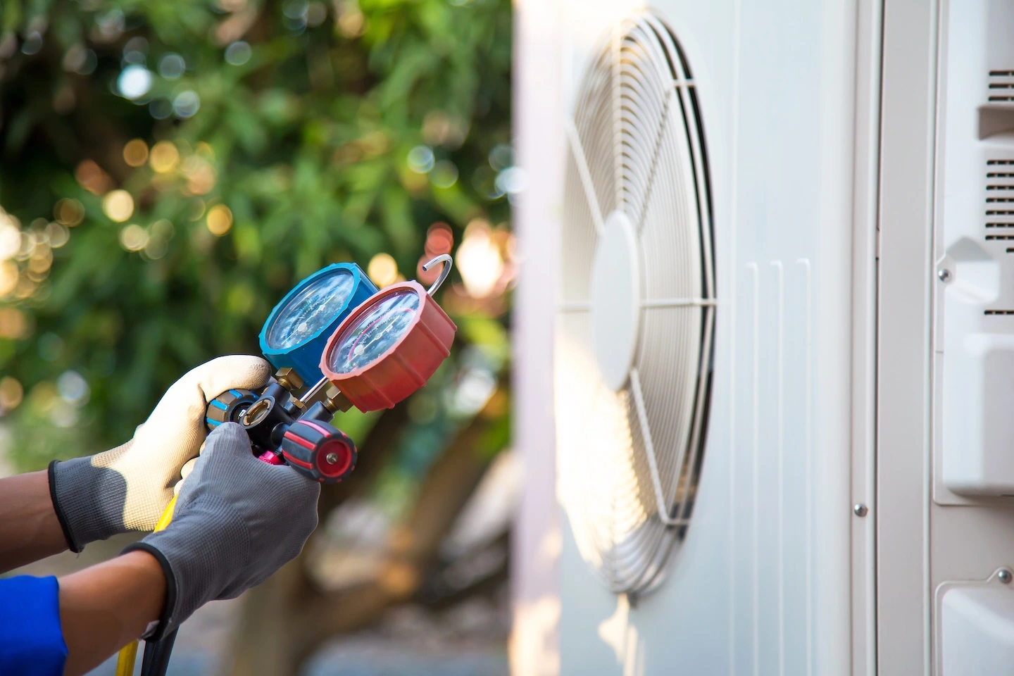 Service technician testing an exterior HVAC unit. 