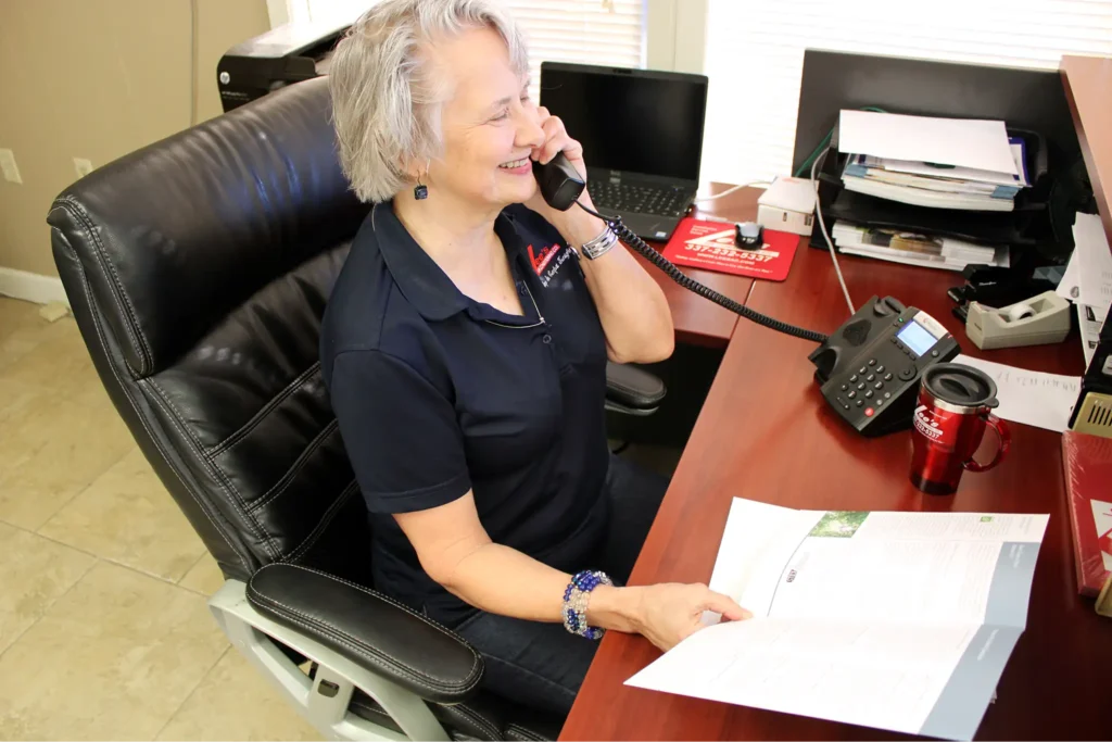 Lee’s employee completing service phone call from the office in Lafayette.
