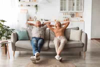 Couple sitting back to relax after choosing a new HVAC system.